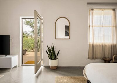 Suite 2's bedroom area offers a luxurious King bed